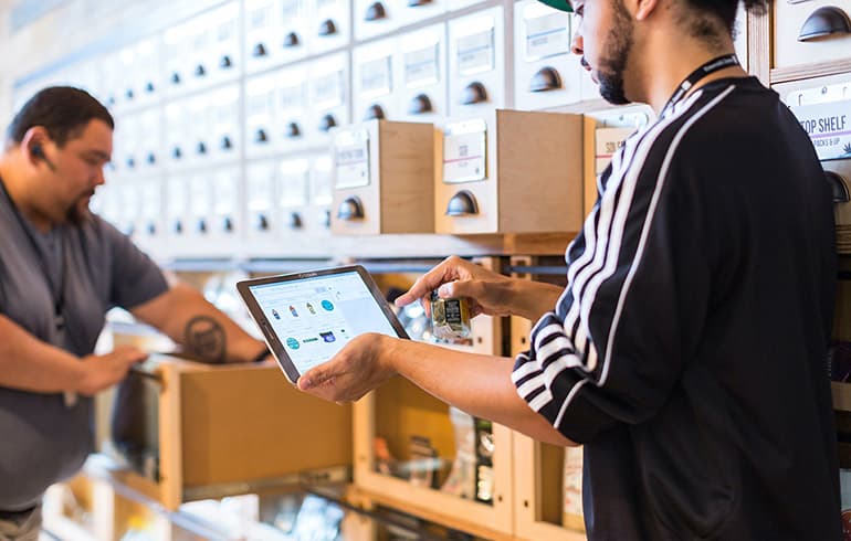Workers moving boxes for an ecommerce merchant.