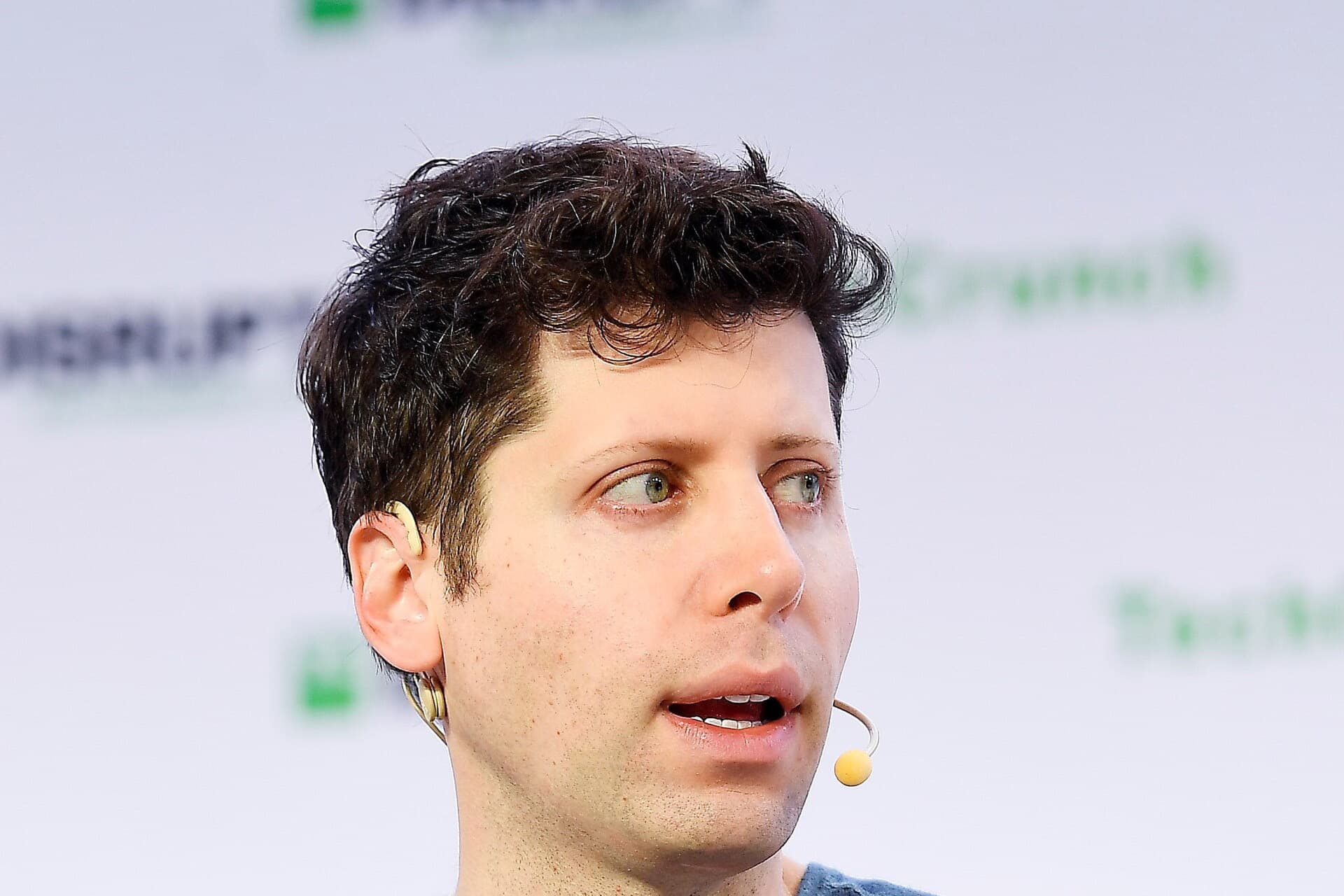 Sam Altman speaking on stage at TechCrunch Disrupt SF 2019