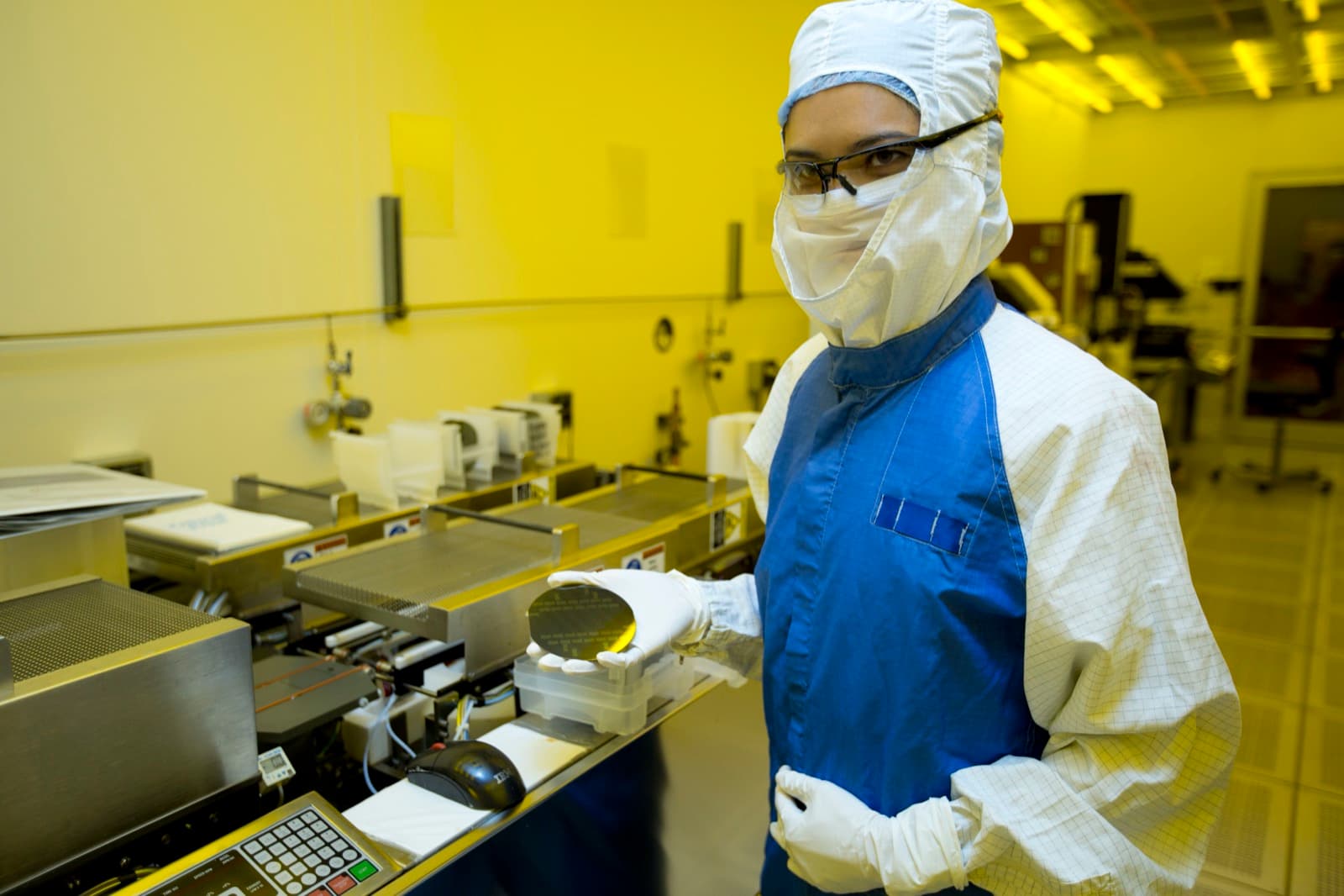 A researcher holding a silicon wafer